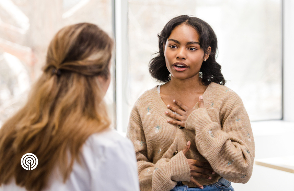 Medical professional and patient talking